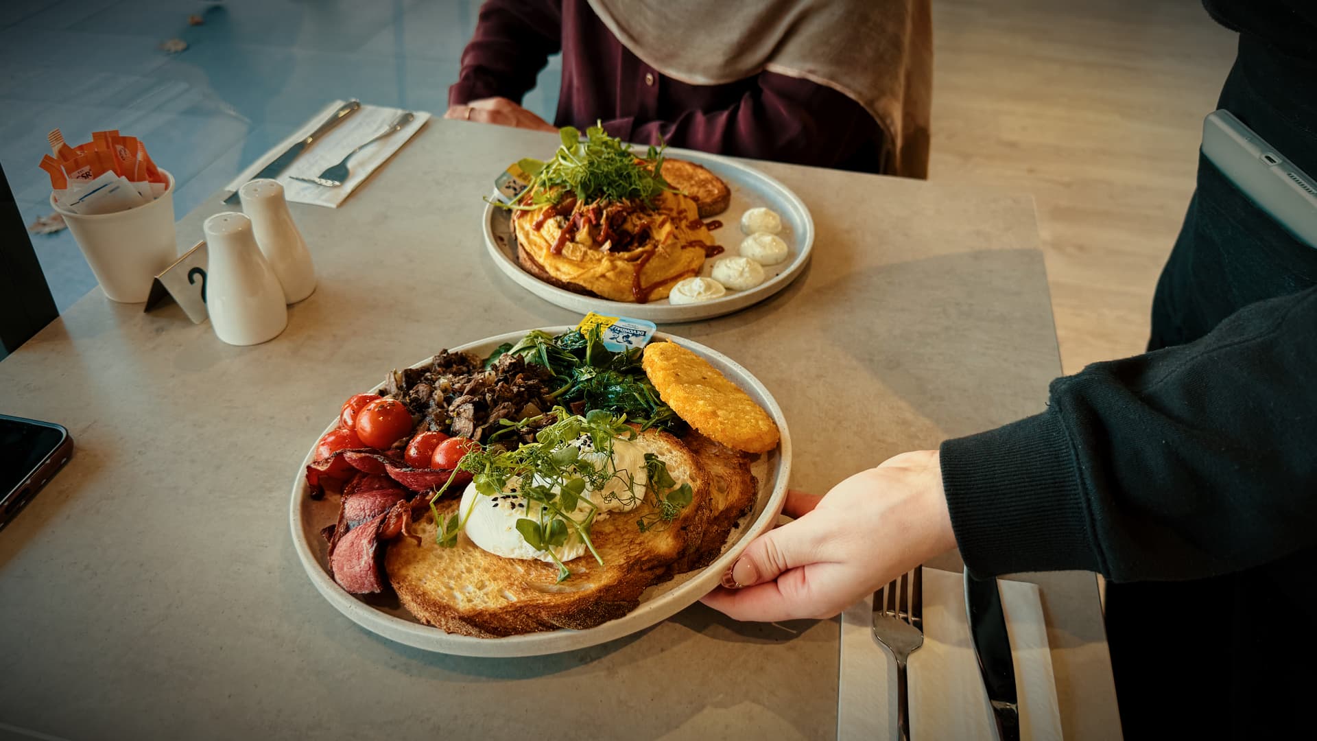 Big Breakfast with poached eggs, beef bacon, mushrooms, spinach, tomatoes and hash brown on sourdough at No9 The Cafe.